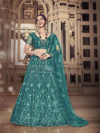 Garb This Partywear Special Designer Lehenga Choli And Dupatta In Dark Color. Blouse,Lahenga And Dupatta Are Soft Net Beautified Fabric With Heavy Thread,Sequance Embroidery Work.Buy Now. 