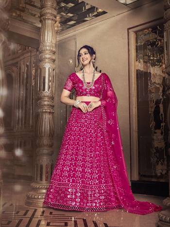 Garb This Partywear Special Designer Lehenga Choli And Dupatta In Dark Color. Blouse,Lahenga And Dupatta Are Soft Net Beautified Fabric With Heavy Thread,Sequance Embroidery Work.Buy Now. 