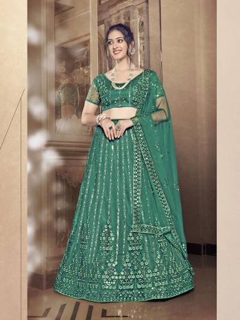 Garb This Partywear Special Designer Lehenga Choli And Dupatta In Dark Color. Blouse,Lahenga And Dupatta Are Soft Net Beautified Fabric With Heavy Thread,Sequance Embroidery Work.Buy Now. 