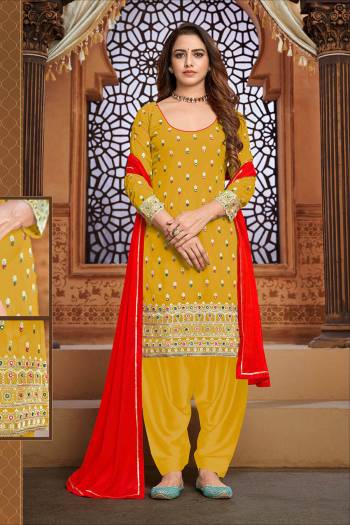 Garb This Designer Patiyala Suit In Fine Color.Its Pretty Heavy Designer Thread,Mirror Embroidery Work Top Is Faux Georgette Based Paired With Santoon Bottom And Maznin Fabricated Dupatta Which Gives An Attractive To The Suit.