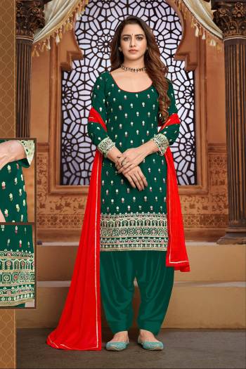 Garb This Designer Patiyala Suit In Fine Color.Its Pretty Heavy Designer Thread,Mirror Embroidery Work Top Is Faux Georgette Based Paired With Santoon Bottom And Maznin Fabricated Dupatta Which Gives An Attractive To The Suit.