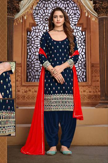 Garb This Designer Patiyala Suit In Fine Color.Its Pretty Heavy Designer Thread,Mirror Embroidery Work Top Is Faux Georgette Based Paired With Santoon Bottom And Maznin Fabricated Dupatta Which Gives An Attractive To The Suit.