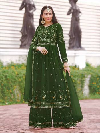 AttrectiveThis Designer Sharara Suit In Lovely Color.Its Pretty Heavy Designer Thread,Sequance Embroidery Work Top Is Faux Georgette Based Paired With Faux Georgette Bottom And Soft Net Fabricated Dupatta Which Gives An Attractive To The Suit.