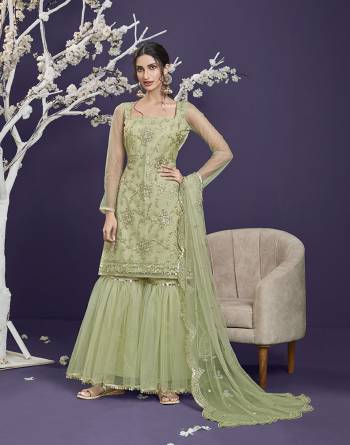 Attrective This Designer Long Length Sharara Suit In Lovely Light Color.Its Pretty Heavy Designer Thread,Sequance Embroidery Work Top Is Butterfly Net Based Paired With Butterfly Net Bottom And Butterfly Net Fabricated Dupatta Which Gives An Attractive To The Suit.Buy Now.