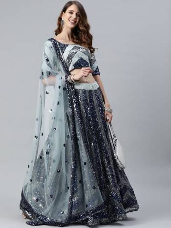 Attrective Bridal Partywear Heavy Designer Lehenga Choli And Dupatta In Grey Color Fabricated On Net Beautified With Heavy Attractive Seaqoance Embroidery Work. 