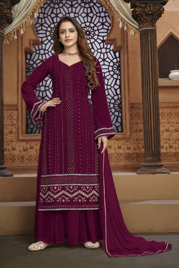 Garb This Designer Sharara Suit In Fine Color.Its Pretty Heavy Designer Thread,Mirror Embroidery Work Top Is Faux Georgette Based Paired With Faux Georgette Bottom And Naznin Fabricated Dupatta Which Gives An Attractive To The Suit.