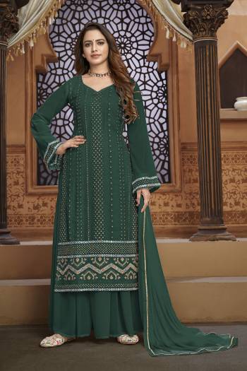 Garb This Designer Sharara Suit In Fine Color.Its Pretty Heavy Designer Thread,Mirror Embroidery Work Top Is Faux Georgette Based Paired With Faux Georgette Bottom And Naznin Fabricated Dupatta Which Gives An Attractive To The Suit.