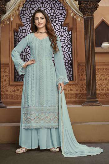 Garb This Designer Sharara Suit In Fine Color.Its Pretty Heavy Designer Thread,Mirror Embroidery Work Top Is Faux Georgette Based Paired With Faux Georgette Bottom And Naznin Fabricated Dupatta Which Gives An Attractive To The Suit.