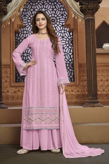 Garb This Designer Sharara Suit In Fine Color.Its Pretty Heavy Designer Thread,Mirror Embroidery Work Top Is Faux Georgette Based Paired With Faux Georgette Bottom And Naznin Fabricated Dupatta Which Gives An Attractive To The Suit.