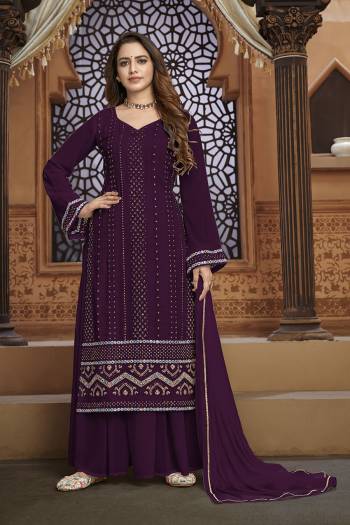 Garb This Designer Sharara Suit In Fine Color.Its Pretty Heavy Designer Thread,Mirror Embroidery Work Top Is Faux Georgette Based Paired With Faux Georgette Bottom And Naznin Fabricated Dupatta Which Gives An Attractive To The Suit.