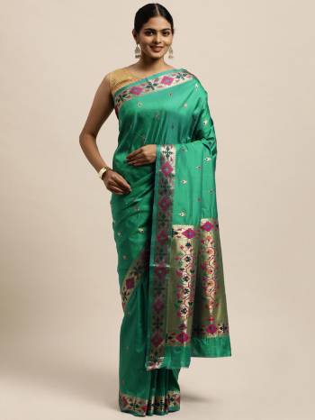 Garb This Traditional Saree Paired With Blouse.This Saree And Blouse Are Silk Based Fabric With Wevon Designer Work. Buy This Pretty Saree Now.