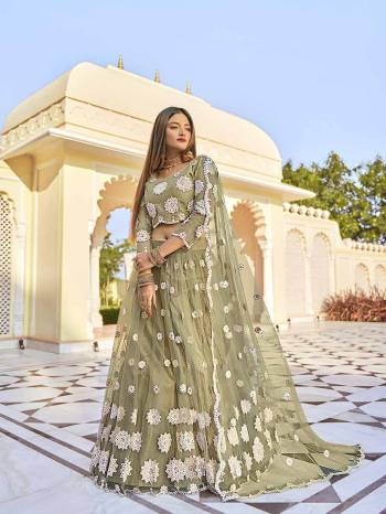 Garb This Wedding Season Special Designer Lehenga Choli And Dupatta In Fine Color. Blouse, Lahenga With Dupatta Are Net Fabric Based With Heavy Designer Thread,Mirror Embroidery Work.Buy Now. 