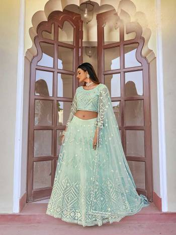 Garb This Wedding Season Special Designer Lehenga Choli And Dupatta In Fine Color. Blouse, Lahenga With Dupatta Are Net Fabric Based With Heavy Designer Thread,Mirror Embroidery Work.Buy Now. 