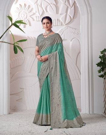 Garb This Partywear Stylist Designer Fine Colour Saree Paired With Blouse.This Saree Are Viscose Silk And Blouse Are Raw Silk Fabric With Heavy Designer Embroidery Work. Buy This Pretty Saree Now.