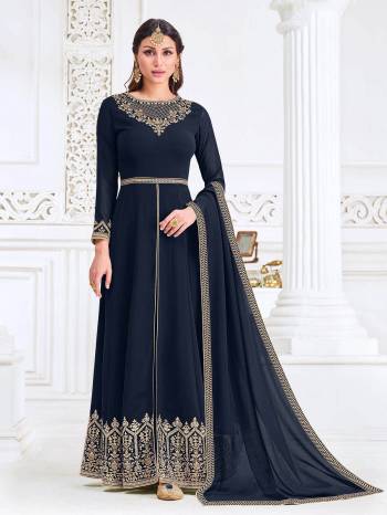 Attrective This Designer Long Length Suit In Lovely Dark Color.Its Pretty Heavy Designer Embroidery Work Top Is Myanmar Georgette Based Paired With Santoon Bottom And Swiss Georgette Fabricated Dupatta Which Gives An Attractive To The Suit.Buy Now.