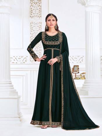 Attrective This Designer Long Length Suit In Lovely Dark Color.Its Pretty Heavy Designer Embroidery Work Top Is Myanmar Georgette Based Paired With Santoon Bottom And Swiss Georgette Fabricated Dupatta Which Gives An Attractive To The Suit.Buy Now.