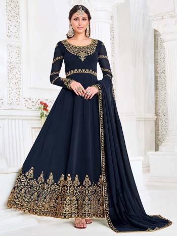 Attrective This Designer Long Length Suit In Lovely Dark Color.Its Pretty Heavy Designer Embroidery Work Top Is Myanmar Georgette Based Paired With Santoon Bottom And Swiss Georgette Fabricated Dupatta Which Gives An Attractive To The Suit.Buy Now.