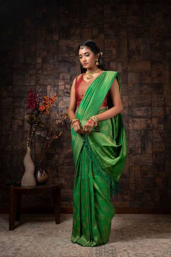 Attrective Looking This Traditional Saree Are Fine Saree Paired With Blouse.This Saree And Blouse Are Raw Silk Based Fabric With Heavy Wevon Designer Work. Buy This Pretty Saree Now.