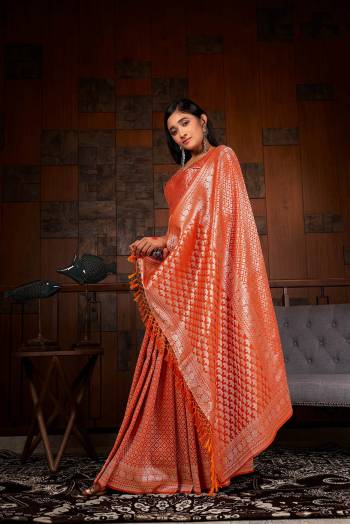 Garb This Traditional Saree Are Fine Saree Paired With Blouse.This Saree And Blouse Are Raw Silk Based Fabric With Heavy Weaving Designer Work. Buy This Pretty Saree Now.