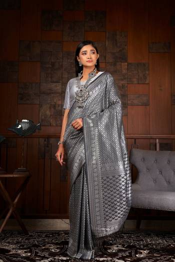 Garb This Traditional Saree Are Fine Saree Paired With Blouse.This Saree And Blouse Are Raw Silk Based Fabric With Heavy Weaving Designer Work. Buy This Pretty Saree Now.