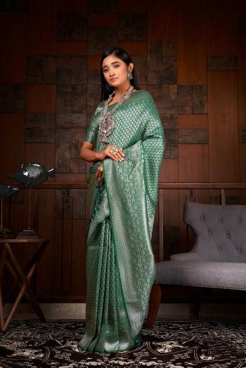 Garb This Traditional Saree Are Fine Saree Paired With Blouse.This Saree And Blouse Are Raw Silk Based Fabric With Heavy Weaving Designer Work. Buy This Pretty Saree Now.