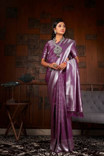 Garb This Traditional Saree Are Fine Saree Paired With Blouse.This Saree And Blouse Are Raw Silk Based Fabric With Heavy Weaving Designer Work. Buy This Pretty Saree Now.