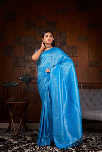 Garb This Traditional Saree Are Fine Saree Paired With Blouse.This Saree And Blouse Are Raw Silk Based Fabric With Heavy Weaving Designer Work. Buy This Pretty Saree Now.