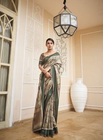 Capture the exuberance of womanhood in its full glory that will bring out your fragility and femininity. Women beauty is magnified tenfold in this alluring creame patola silk contemporary saree. The lovely weaving work throughout the attire is awe inspiring. Comes with Contrast blouse piece