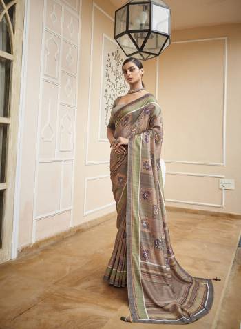 Capture the exuberance of womanhood in its full glory that will bring out your fragility and femininity. Women beauty is magnified tenfold in this alluring creame patola silk contemporary saree. The lovely weaving work throughout the attire is awe inspiring. Comes with Contrast blouse piece