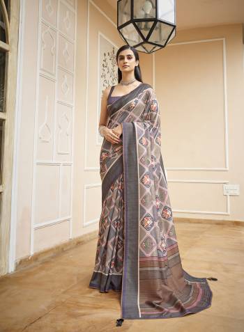 Capture the exuberance of womanhood in its full glory that will bring out your fragility and femininity. Women beauty is magnified tenfold in this alluring creame patola silk contemporary saree. The lovely weaving work throughout the attire is awe inspiring. Comes with Contrast blouse piece