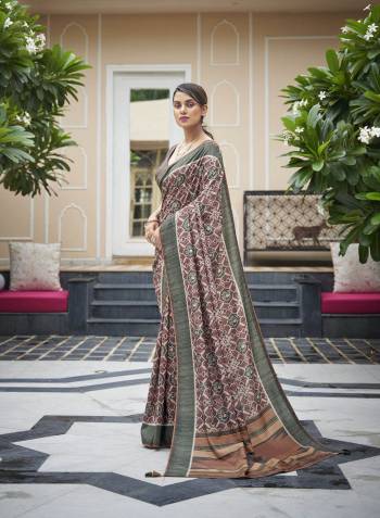 Capture the exuberance of womanhood in its full glory that will bring out your fragility and femininity. Women beauty is magnified tenfold in this alluring creame patola silk contemporary saree. The lovely weaving work throughout the attire is awe inspiring. Comes with Contrast blouse piece