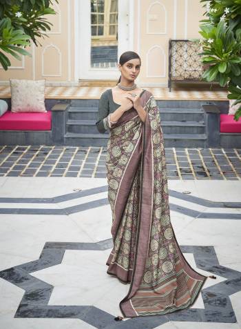 Capture the exuberance of womanhood in its full glory that will bring out your fragility and femininity. Women beauty is magnified tenfold in this alluring creame patola silk contemporary saree. The lovely weaving work throughout the attire is awe inspiring. Comes with Contrast blouse piece