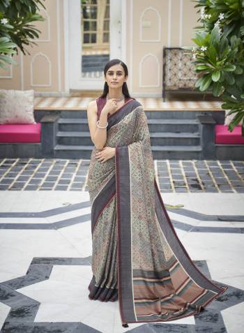 Capture the exuberance of womanhood in its full glory that will bring out your fragility and femininity. Women beauty is magnified tenfold in this alluring creame patola silk contemporary saree. The lovely weaving work throughout the attire is awe inspiring. Comes with Contrast blouse piece