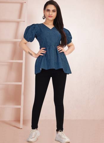 This Blue color designer Top is adding the attractive glamorous displaying the sense of cute and graceful. This attire is very well made with printed.