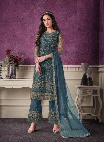 Shine Bright Wearing This Suit In Lovely Color Its Top Is Fabricated On Soft Net Paired With Soft Net Bottom And  Dupatta. Its Top Is Beautified With Designer Embroidery. Buy This Amazing Collection Now