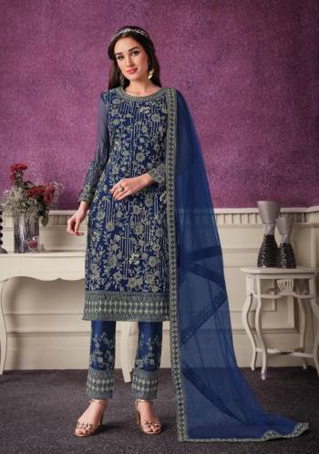 Shine Bright Wearing This Suit In Lovely Color Its Top Is Fabricated On Soft Net Paired With Soft Net Bottom And  Dupatta. Its Top Is Beautified With Designer Embroidery. Buy This Amazing Collection Now