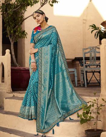 For A Royal And Beautiful Look, Grab This Designer Saree In Pretty Color Paired?With  Designer Blouse. This Saree Is Fabricated On Silk Paired With Raw Silk Fabricated Blouse. Its Pretty Color Pallete And Fabric Will Earn You Lots Of Compliments From onlookers