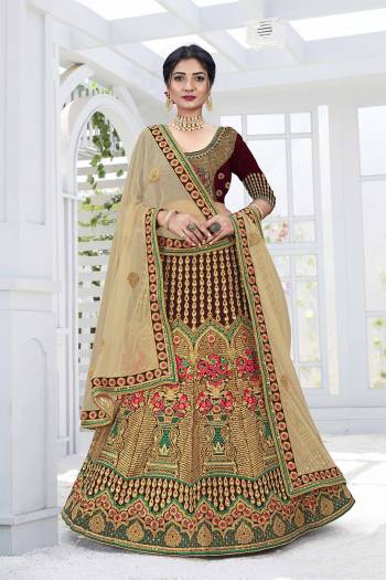 Get Ready For Your D-Day With This Heavy Designer Lehenga Choli In Lovely Color Paired With Pretty Colored Dupatta. Its Blouse And Lehenga Are Fabricated On Velvet Paired With Net Dupattas. Its Lovely Bridal Color Pallete Will Earn You Lots Of Compliments From Onlookers.