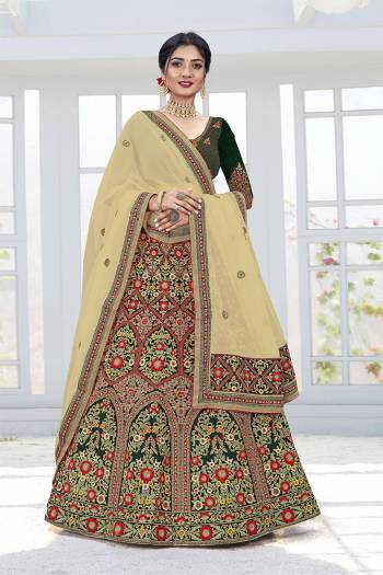 Get Ready For Your D-Day With This Heavy Designer Lehenga Choli In Lovely Color Paired With Pretty Colored Dupatta. Its Blouse And Lehenga Are Fabricated On Velvet Paired With Net Dupattas. Its Lovely Bridal Color Pallete Will Earn You Lots Of Compliments From Onlookers.