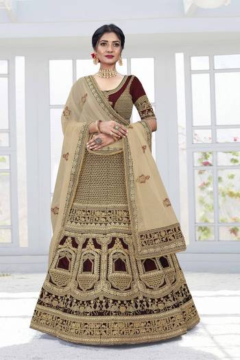 Get Ready For Your D-Day With This Heavy Designer Lehenga Choli In Lovely Color Paired With Pretty Colored Dupatta. Its Blouse And Lehenga Are Fabricated On Velvet Paired With Net Dupattas. Its Lovely Bridal Color Pallete Will Earn You Lots Of Compliments From Onlookers.