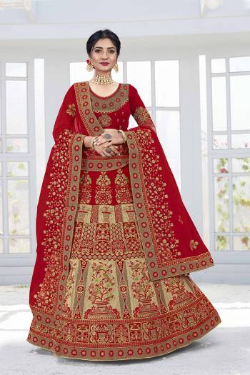 Get Ready For Your D-Day With This Heavy Designer Lehenga Choli In Lovely Color Paired With Pretty Colored Dupatta. Its Blouse And Lehenga Are Fabricated On Velvet Paired With Net Dupattas. Its Lovely Bridal Color Pallete Will Earn You Lots Of Compliments From Onlookers.