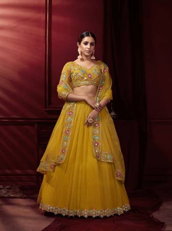 This Wedding Season, Be The Most Attractive Wearing This Heavy Designer Lehenga?Choli In Beautifull Colored Paired With Pretty Blouse And Dupatta. Its Blouse And Lehenga Are Net With Satin Based Paired With Net Fabricated Dupatta.Grab This lovely Collection Now