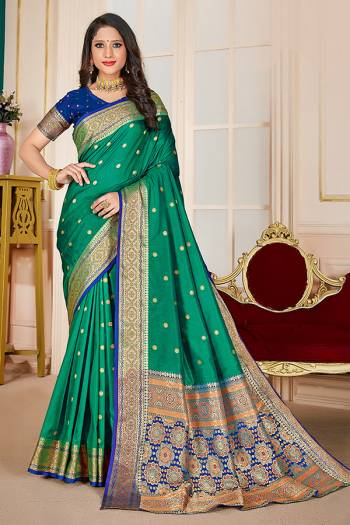 Adorn A Rich Look Wearing This Pretty Saree In Lovely Color Paired With Contrasting Beautifull Colored Blouse. This Saree and Blouse Are Fabricated On Silk Beautified With Attractive Woven. Buy Now.