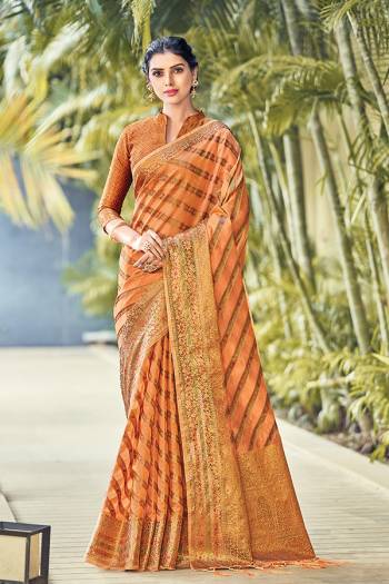 Garb This Tassle Saree Paired With Blouse.This Saree And Blouse Are Organza Based Fabric With Wevon Rich Pallu Designer Work. Buy This Pretty Saree Now.