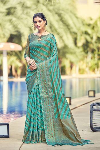 Garb This Tassle Saree Paired With Blouse.This Saree And Blouse Are Organza Based Fabric With Wevon Rich Pallu Designer Work. Buy This Pretty Saree Now.