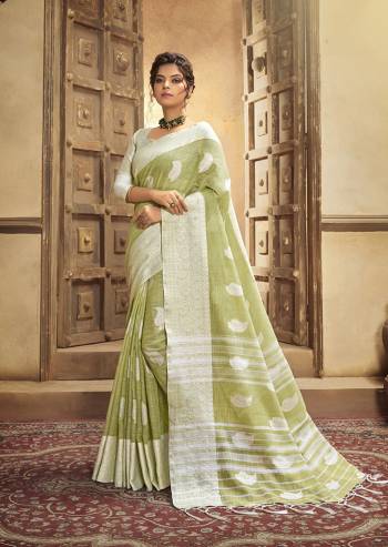 Your Personality In This Lovely Colored Designer Saree. This Saree?And Blouse Are Fabricated On Cottont Linen Beautified With Wevon Designer. Buy This Pretty Saree Now.