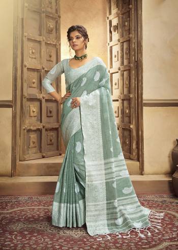 Your Personality In This Lovely Colored Designer Saree. This Saree?And Blouse Are Fabricated On Cottont Linen Beautified With Wevon Designer. Buy This Pretty Saree Now.