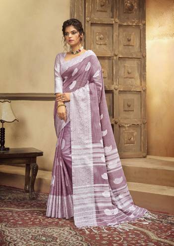 Your Personality In This Lovely Colored Designer Saree. This Saree?And Blouse Are Fabricated On Cottont Linen Beautified With Wevon Designer. Buy This Pretty Saree Now.