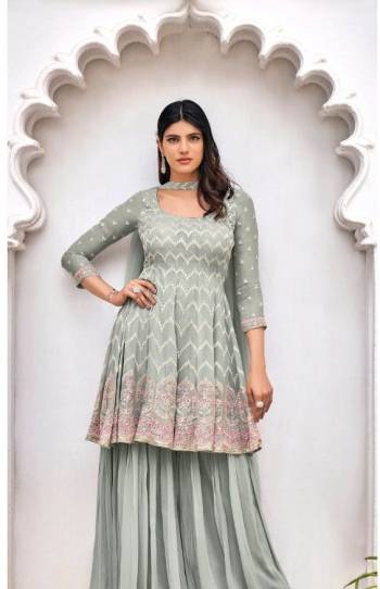 Garb This Designer Sharara Suit In Fine Color.Its Pretty Heavy Designer Embroidery Work Top Is Viscose Georgette Based Paired With Viscose Georgette Bottom And Soft Net Fabricated Dupatta Which Gives An Attractive To The Suit.