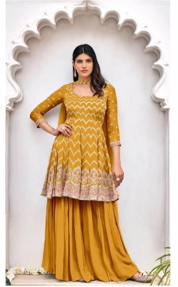 Garb This Designer Sharara Suit In Fine Color.Its Pretty Heavy Designer Embroidery Work Top Is Viscose Georgette Based Paired With Viscose Georgette Bottom And Soft Net Fabricated Dupatta Which Gives An Attractive To The Suit.